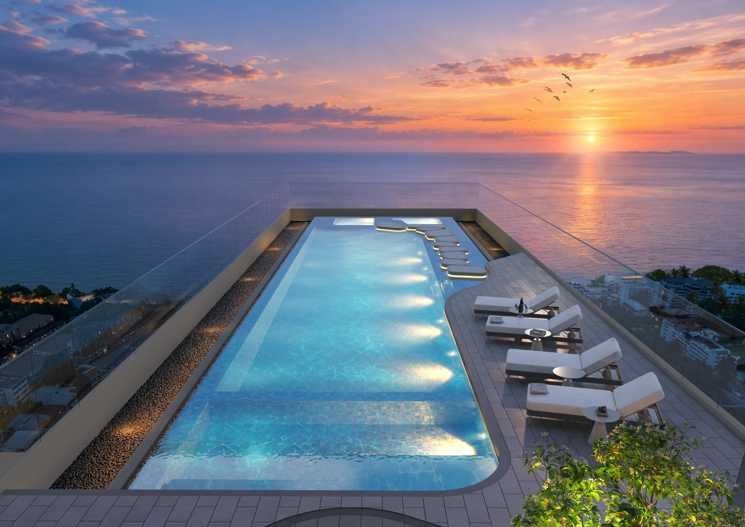 Pool overlooking the coast at sunset